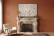 Load image into Gallery viewer, Cowboys and Models... at it Again!! by IsaLu Ishii – framed colourful figurative artwork featuring multiple cowboys in minimal clothing, drawn with fine red, blue, green and black lines on a warm off-white background hung on a warm terracotta coloured wall above a fireplace.