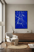 Load image into Gallery viewer, Torero... White!! by IsaLu Ishii - a framed art print featuring a stylized, abstract torero in white on a blue background with floral patterns, displayed in a modern setting.
